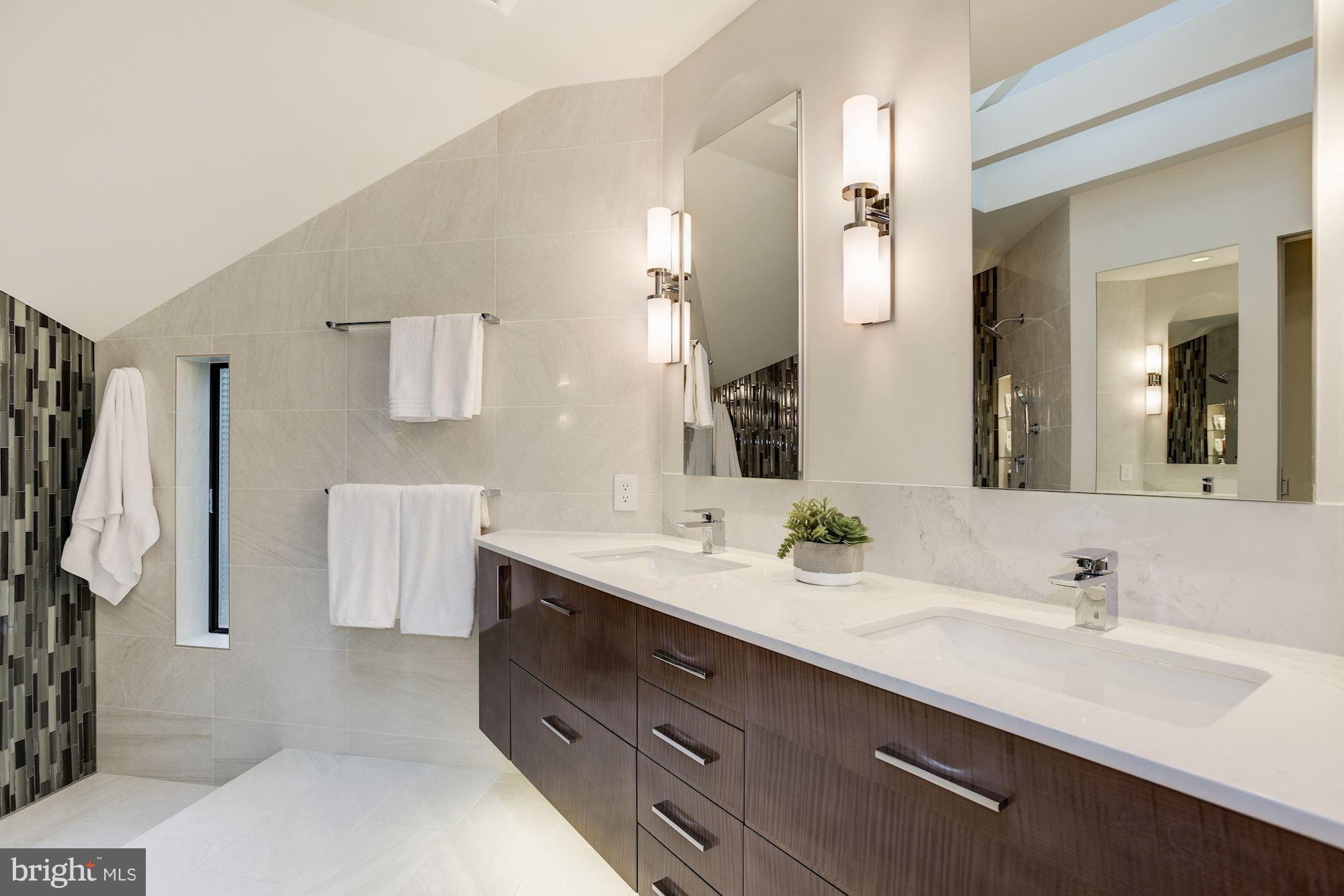 2119 Owls Cove Lane Reston, VA 20191 - Photo 16 of 30 a bathroom with a double vanity sink mirror and shower
