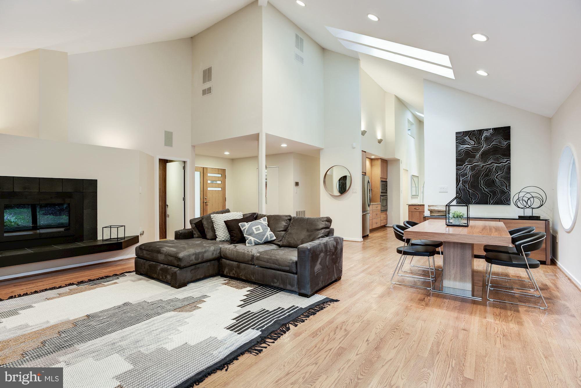 2119 Owls Cove Lane Reston, VA 20191 - Photo 5 of 30 a living room with furniture a large window and a fireplace