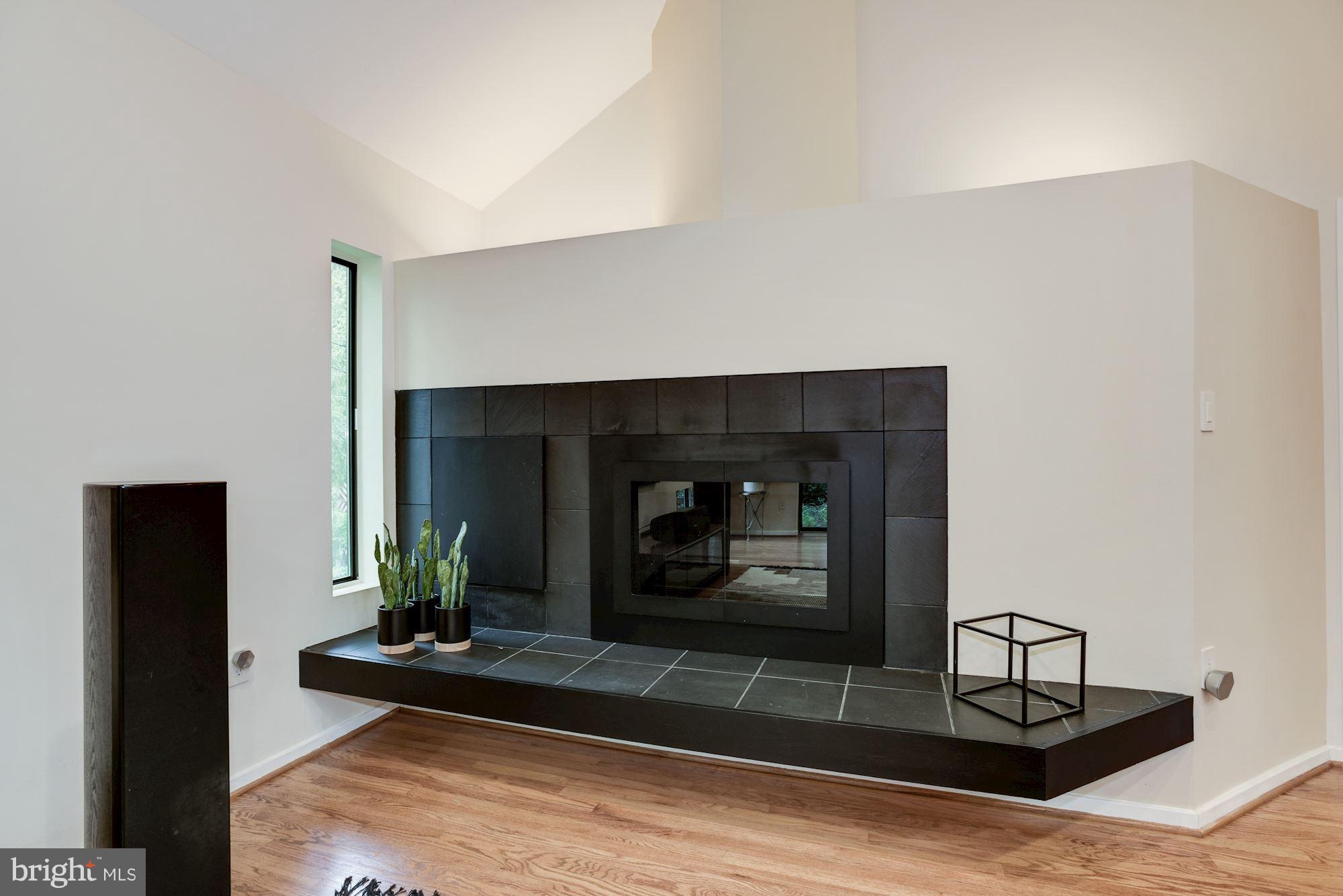 2119 Owls Cove Lane Reston, VA 20191 - Photo 6 of 30 a living room with furniture and a fireplace