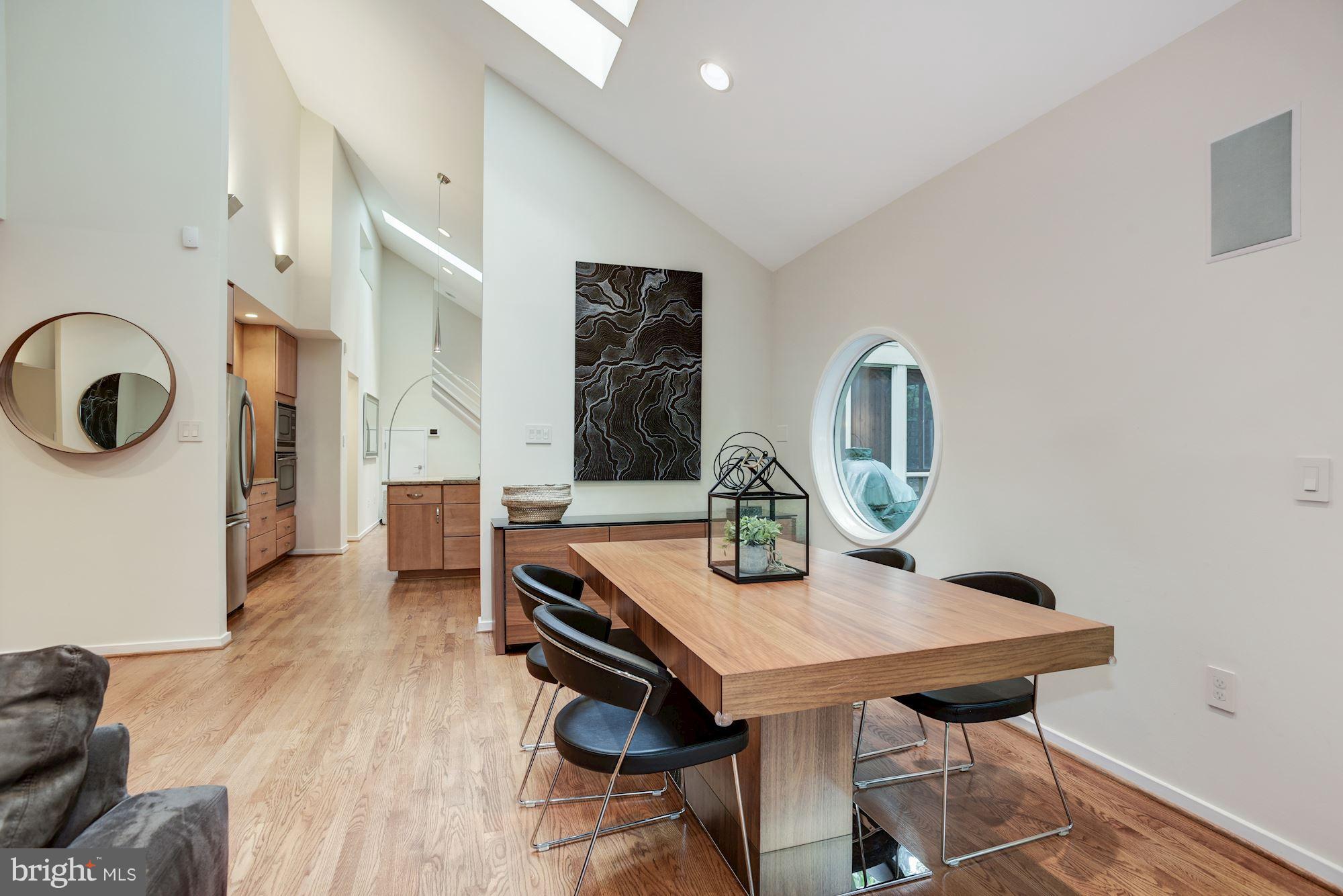 2119 Owls Cove Lane Reston, VA 20191 - Photo 7 of 30 a view of a dining room with furniture and a chandelier