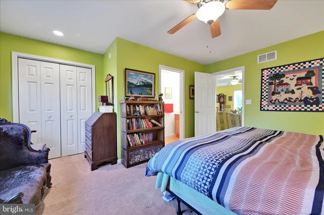 a bed room with a bed and a chandelier