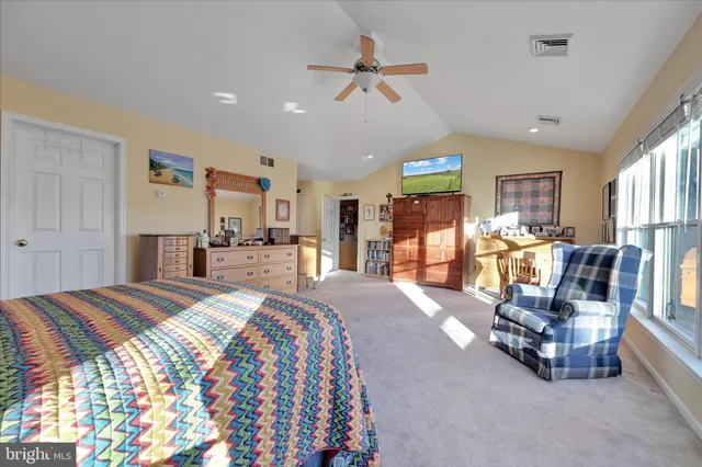 a utility room with a sink a mirror and a window