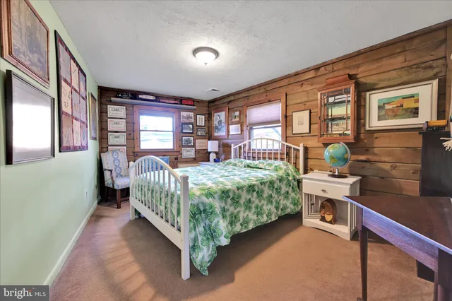 a bedroom with furniture and window