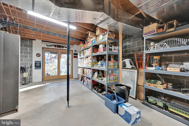 a view of a patio with table and chairs with wooden floor and fence