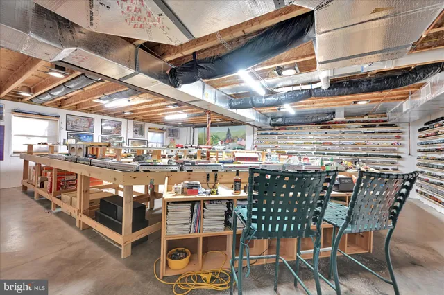 a view of a chairs and table in the balcony