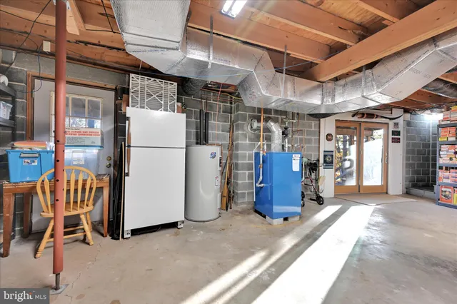 a view of a lake with tables and chairs