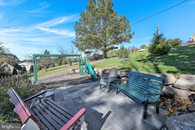 an aerial view of a houses with yard