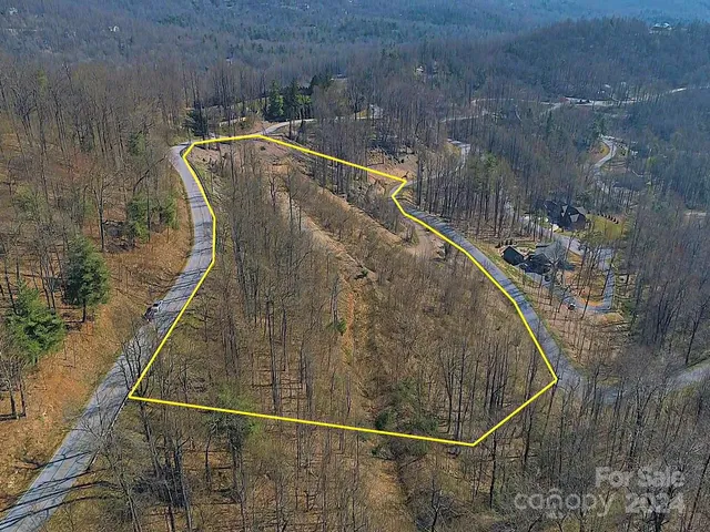 a view of a swimming pool with a yard