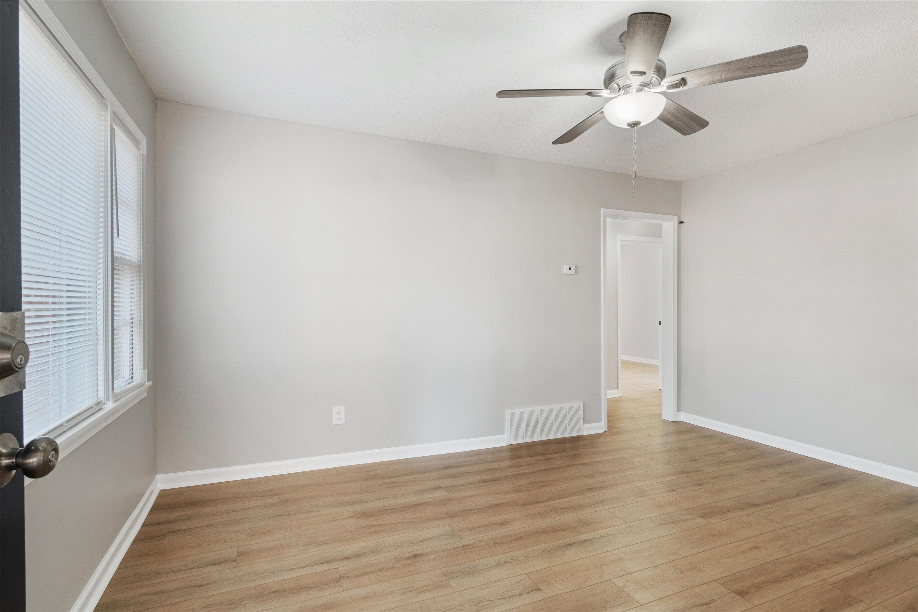 4487 East Dearing Road Memphis, TN 38117 - Photo 4 of 27 Unfurnished room with light wood-style floors and a ceiling fan