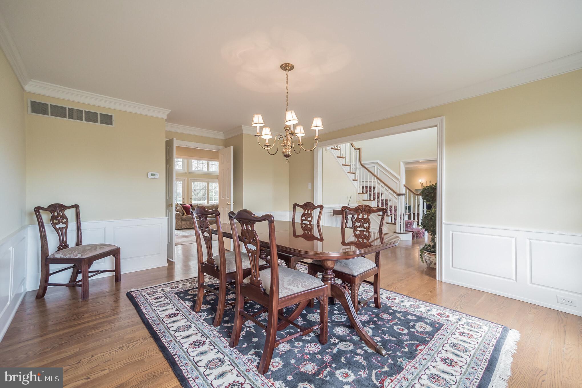880 Springbank Lane Wayne, PA 19087 - Photo 8 of 43 a view of a dining room with furniture and wooden floor