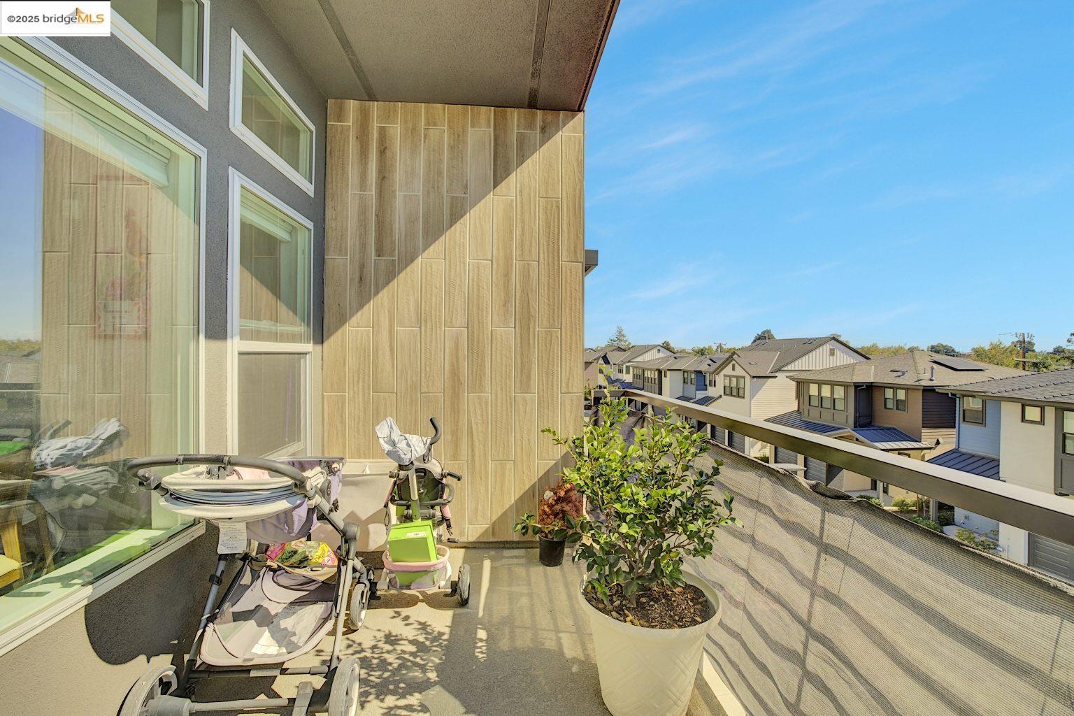 210 Waters Park Circle, Unit 304 San Mateo, CA 94403 - Photo 12 of 17 a view of a balcony with chairs and a table