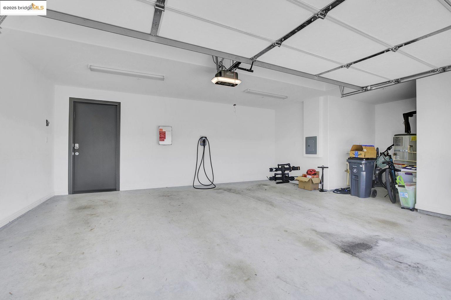 210 Waters Park Circle, Unit 304 San Mateo, CA 94403 - Photo 14 of 17 a view of a garage with a bike and storage