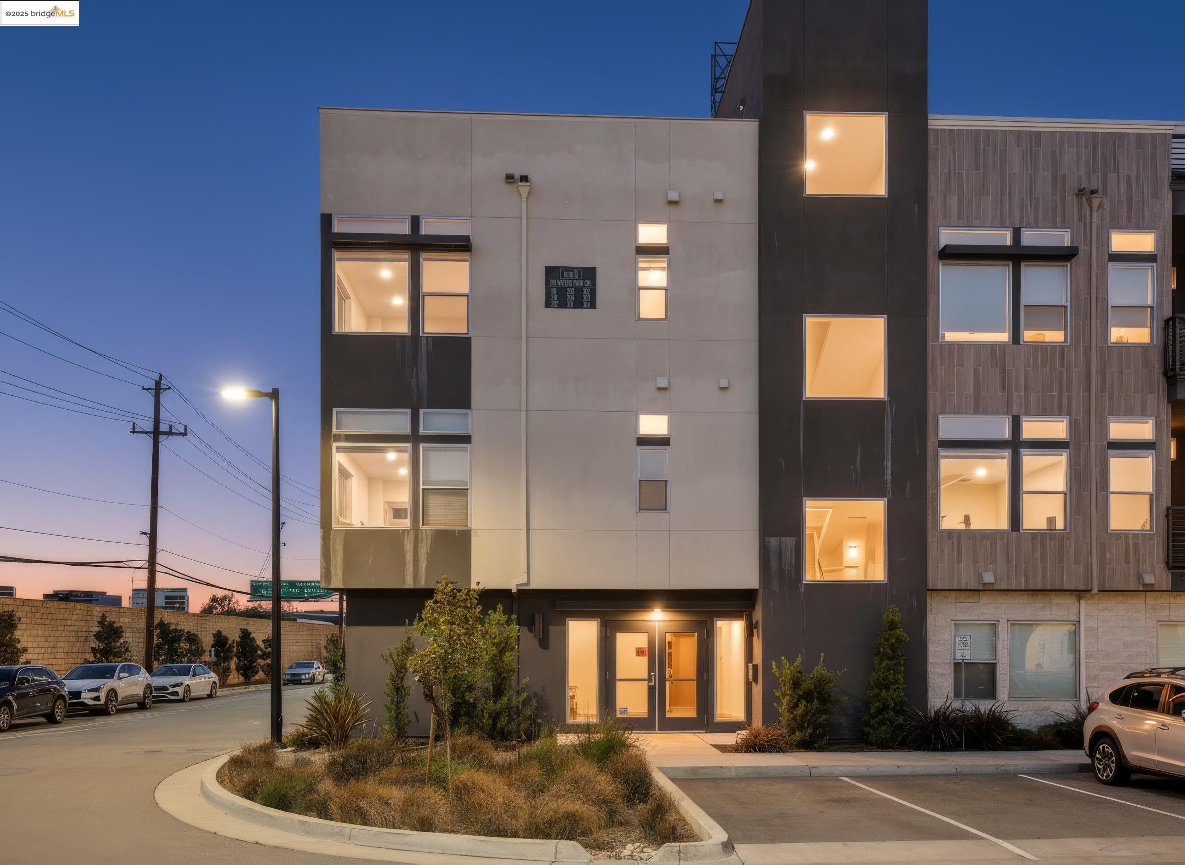210 Waters Park Circle, Unit 304 San Mateo, CA 94403 - Photo 2 of 17 a view of a building with a street