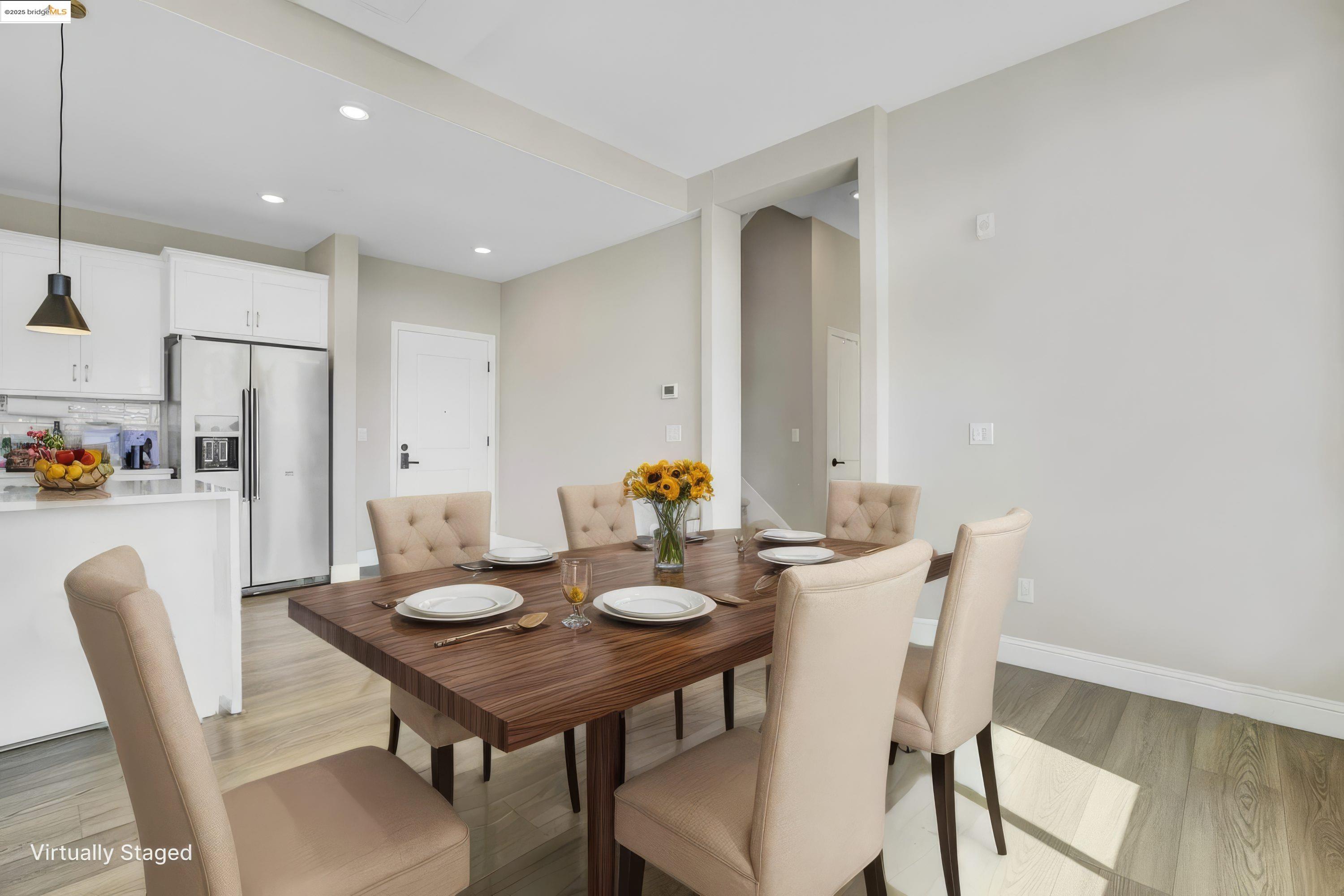 210 Waters Park Circle, Unit 304 San Mateo, CA 94403 - Photo 5 of 17 a view of a dining room with furniture and wooden floor
