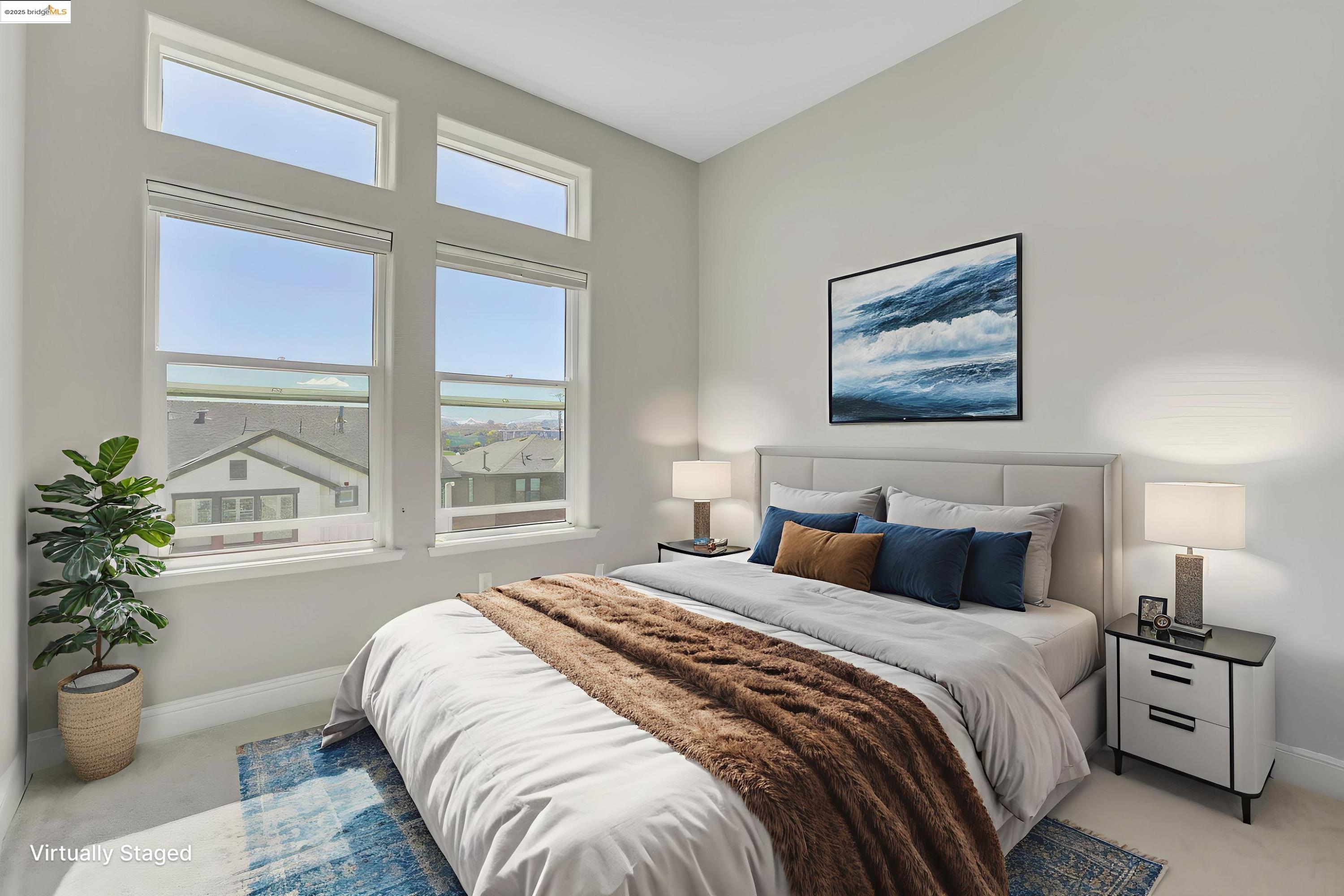 210 Waters Park Circle, Unit 304 San Mateo, CA 94403 - Photo 8 of 17 a bedroom with a large bed and a potted plant