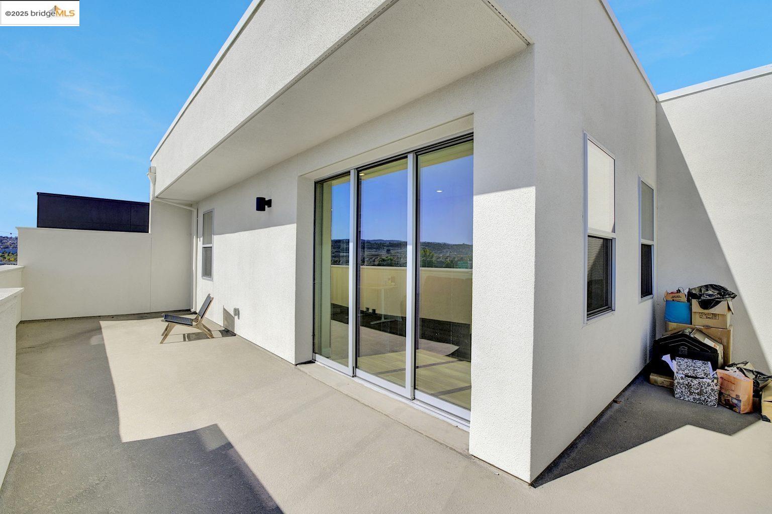 210 Waters Park Circle, Unit 304 San Mateo, CA 94403 - Photo 10 of 17 a view of a hallway with closet and workspace