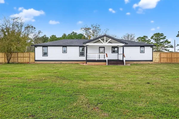 a view of a house with a big yard