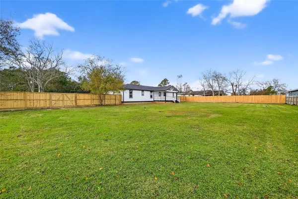 a view of a lake with a yard