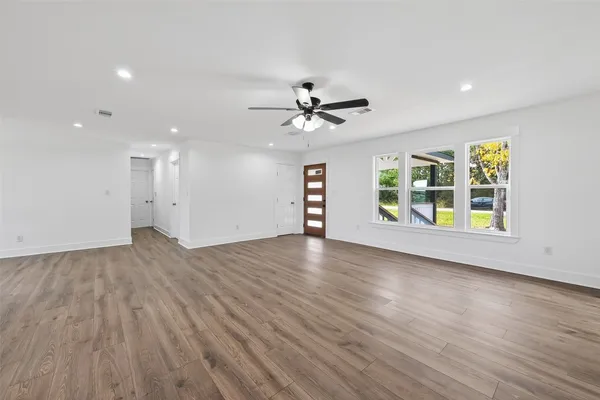 a view of a kitchen with a sink and a window