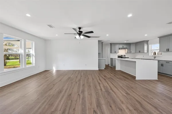 a kitchen with a stove a sink and a refrigerator