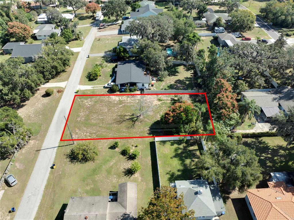 0 East Myrtle Street Howey-in-the-Hills, FL 34737 - Photo 4 of 13 an aerial view of houses with outdoor space