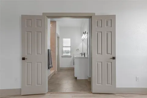 wooden floor with white walls