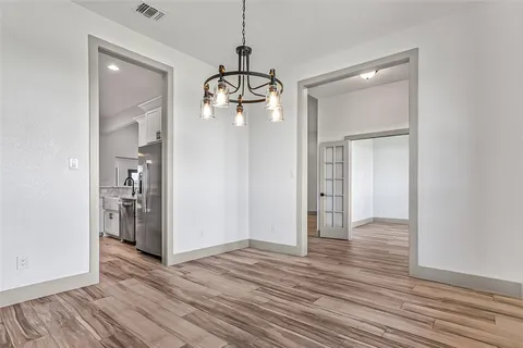 a view of livingroom with hardwood floor and hallway