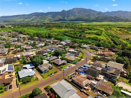 an aerial view of residential house with outdoor space and mountain view
