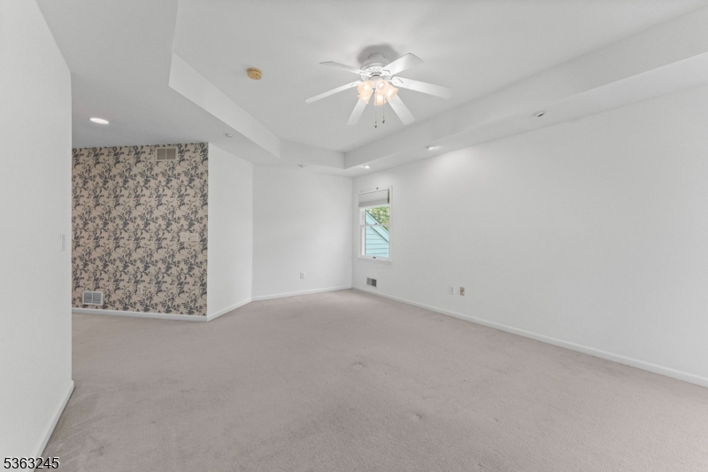 2 Seminole Road Skillman, NJ 08558 - Photo 39 of 50 en empty room with windows and fan