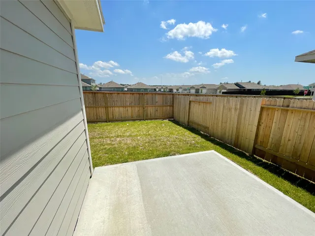 a view of a swimming pool with an outdoor seating