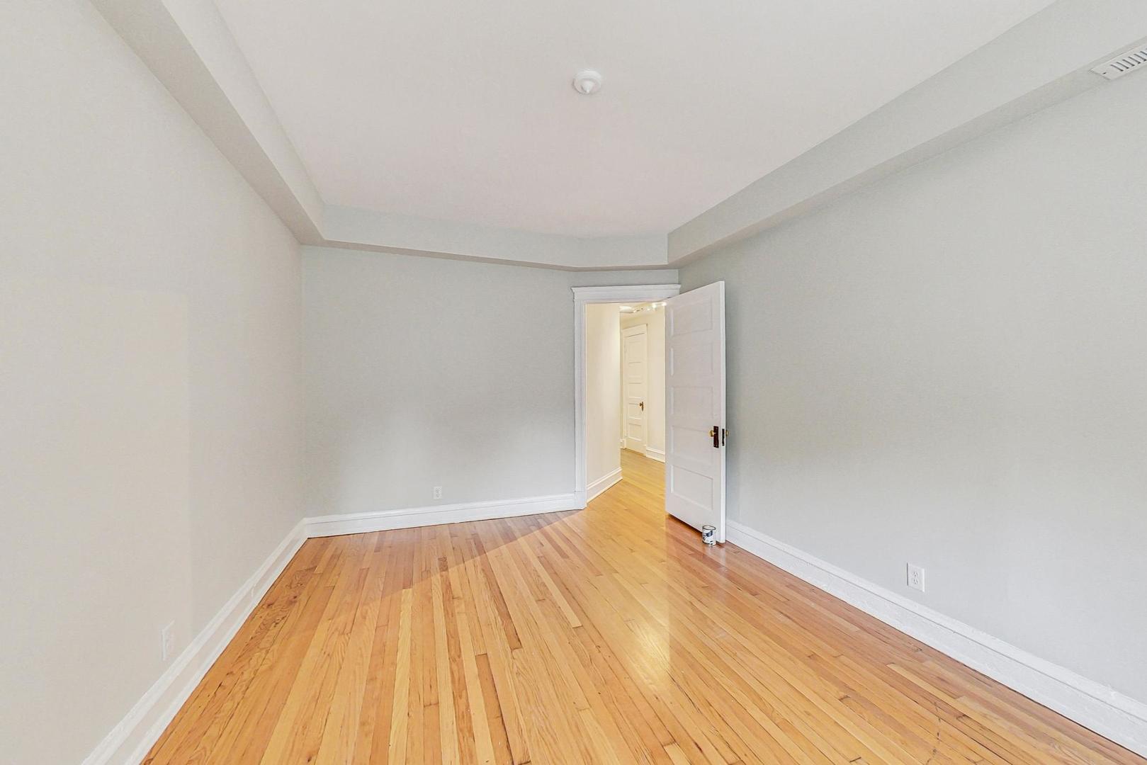 4000 North Hermitage Avenue, Unit 1 Chicago, IL 60613 - Photo 14 of 28 a view of a room with wooden floor and small space
