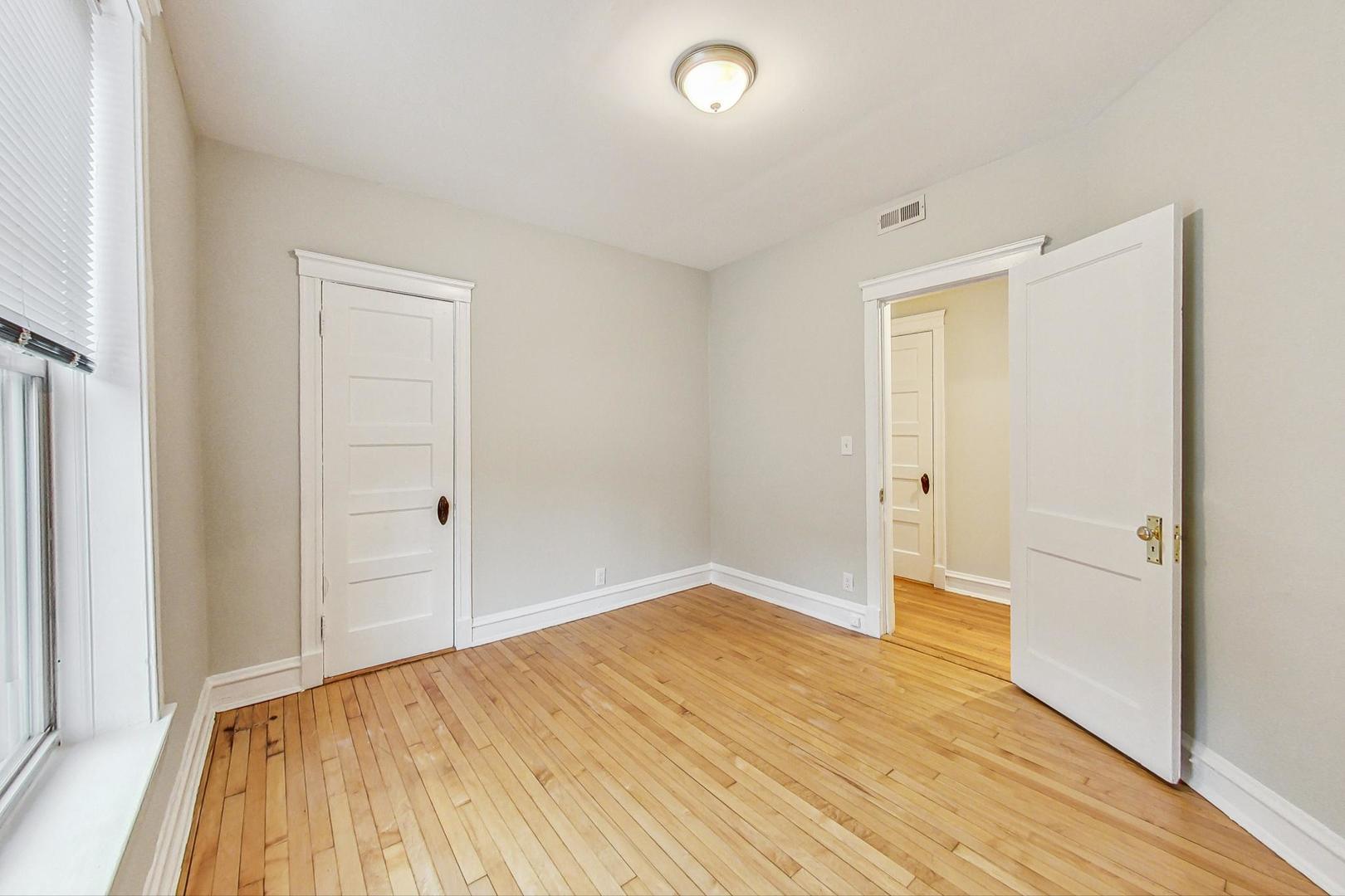 4000 North Hermitage Avenue, Unit 1 Chicago, IL 60613 - Photo 17 of 28 a view of hallway with wooden floor