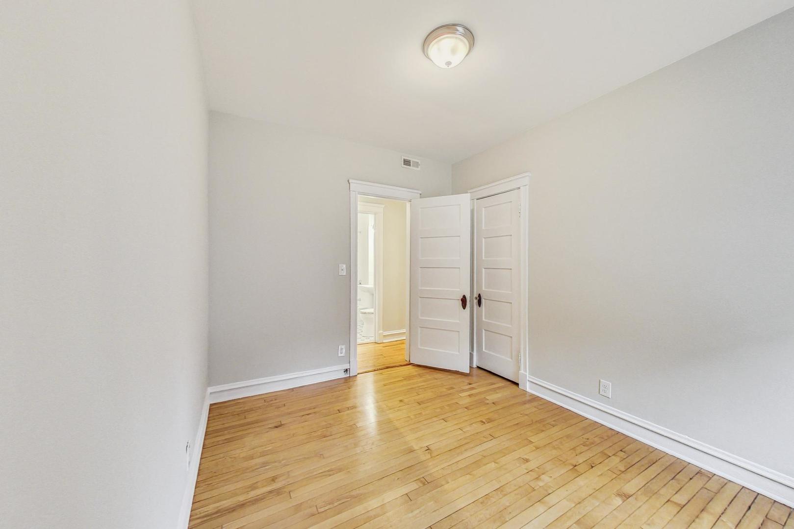 4000 North Hermitage Avenue, Unit 1 Chicago, IL 60613 - Photo 20 of 28 a view of empty room with wooden floor