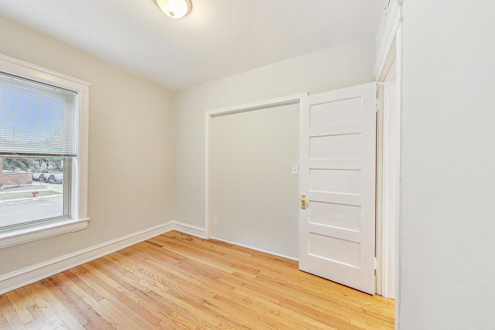 4000 North Hermitage Avenue, Unit 1 Chicago, IL 60613 - Photo 22 of 28 a view of empty room with wooden floor