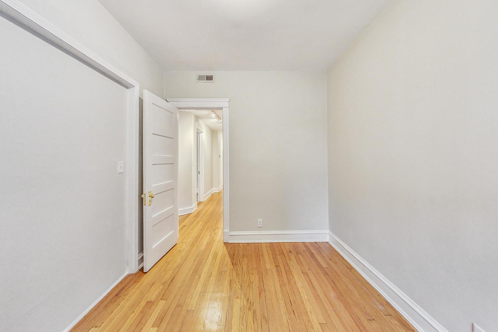 4000 North Hermitage Avenue, Unit 1 Chicago, IL 60613 - Photo 23 of 28 a view of a room with wooden floor and a balcony