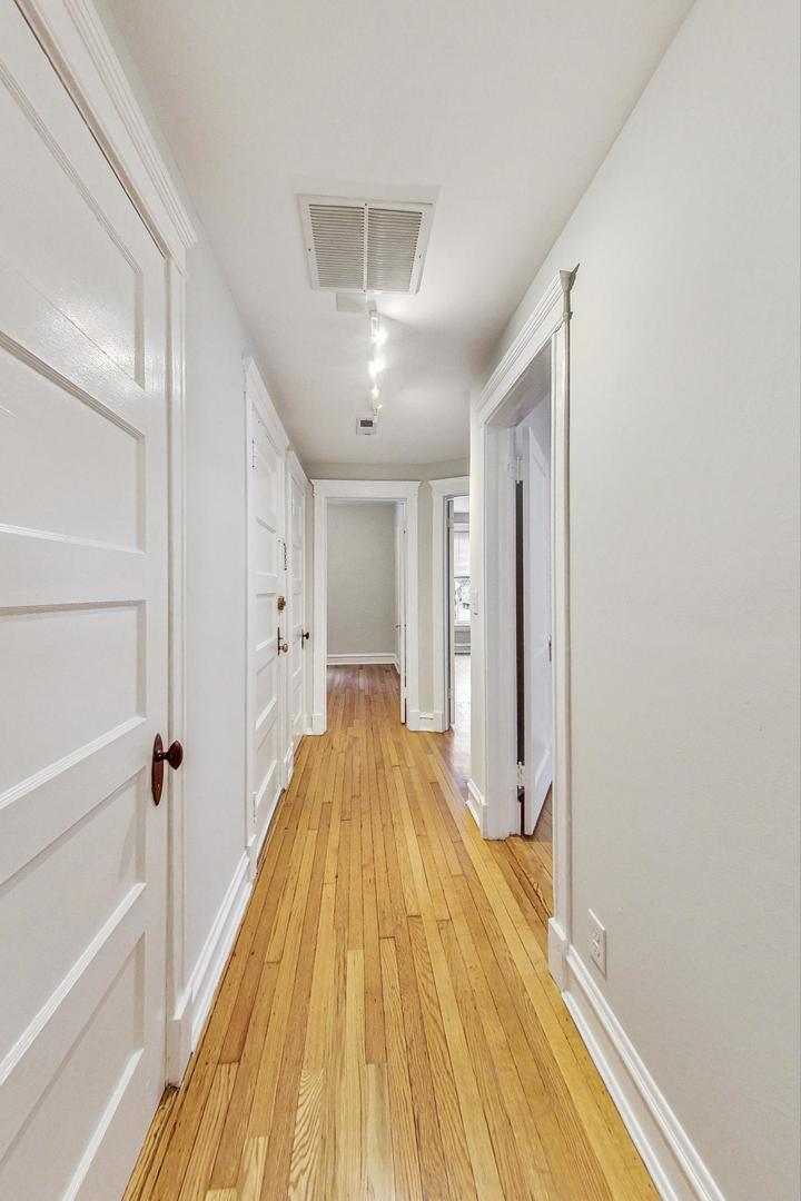4000 North Hermitage Avenue, Unit 1 Chicago, IL 60613 - Photo 4 of 28 a view of a bathroom with a tub and shower