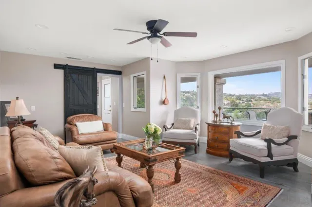 a living room with furniture and a window