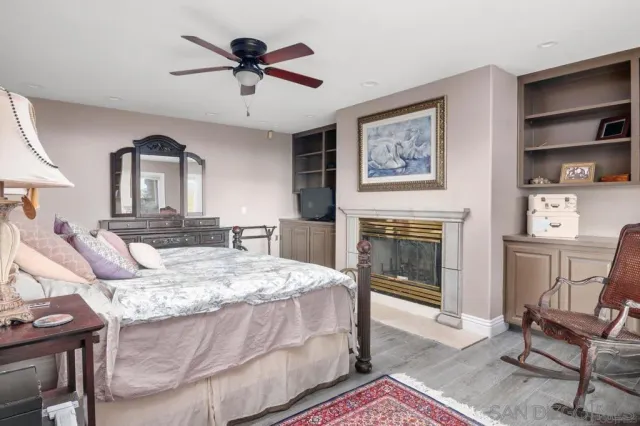 a bed room with a bed and a fireplace