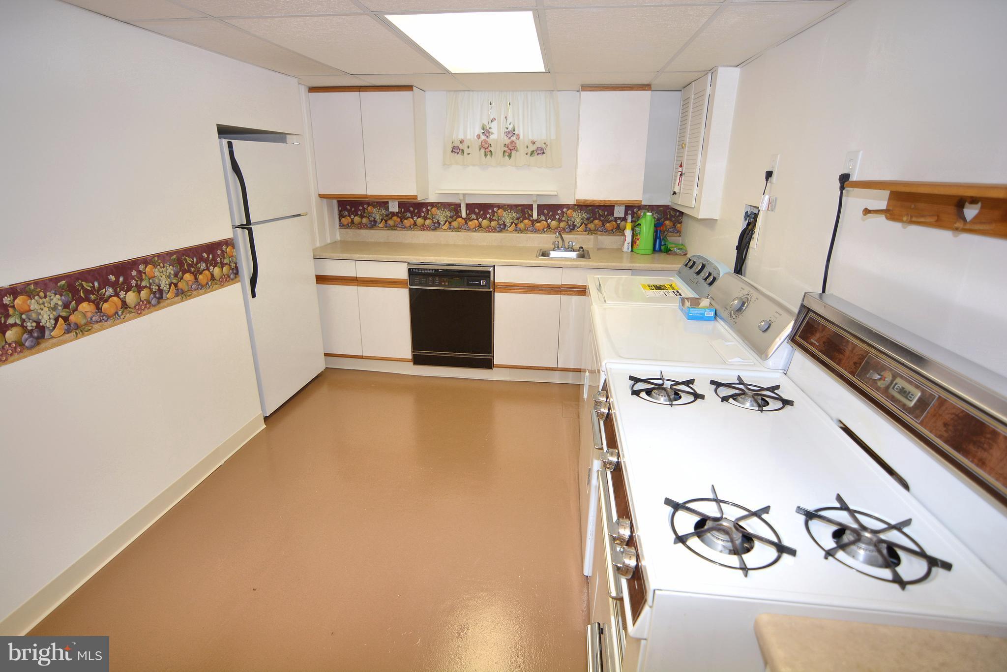 400 Ridgely Road Glen Burnie, MD 21061 - Photo 16 of 27 Lower level kitchen with recessed refrigerator.