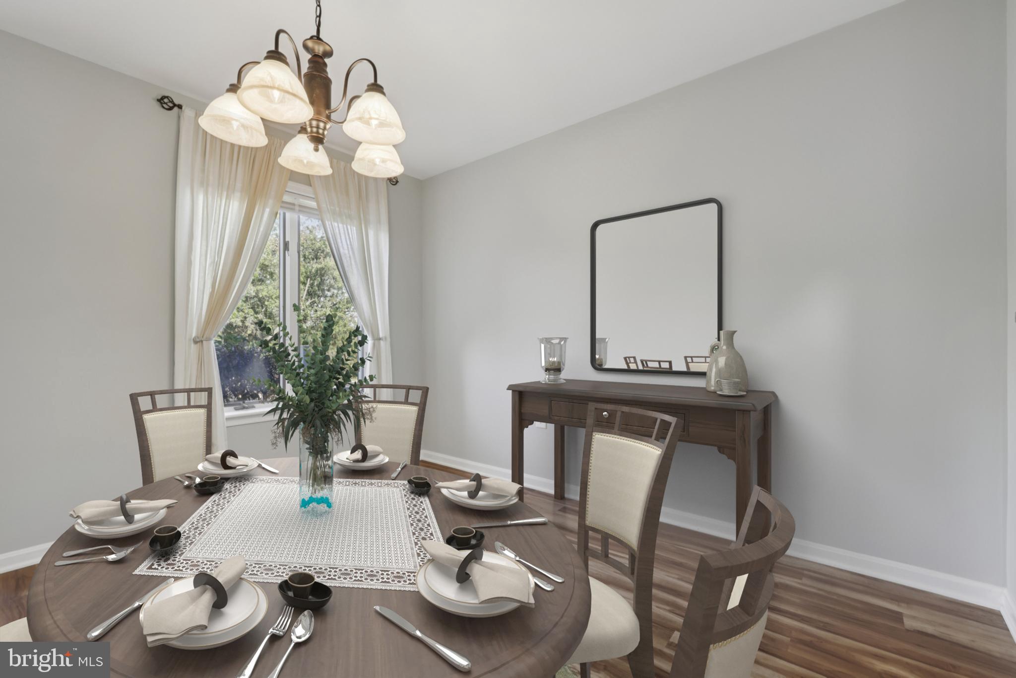 465 Pleasanton Road, Unit C14 Westminster, MD 21157 - Photo 11 of 39 a view of a dining room with furniture and chandelier