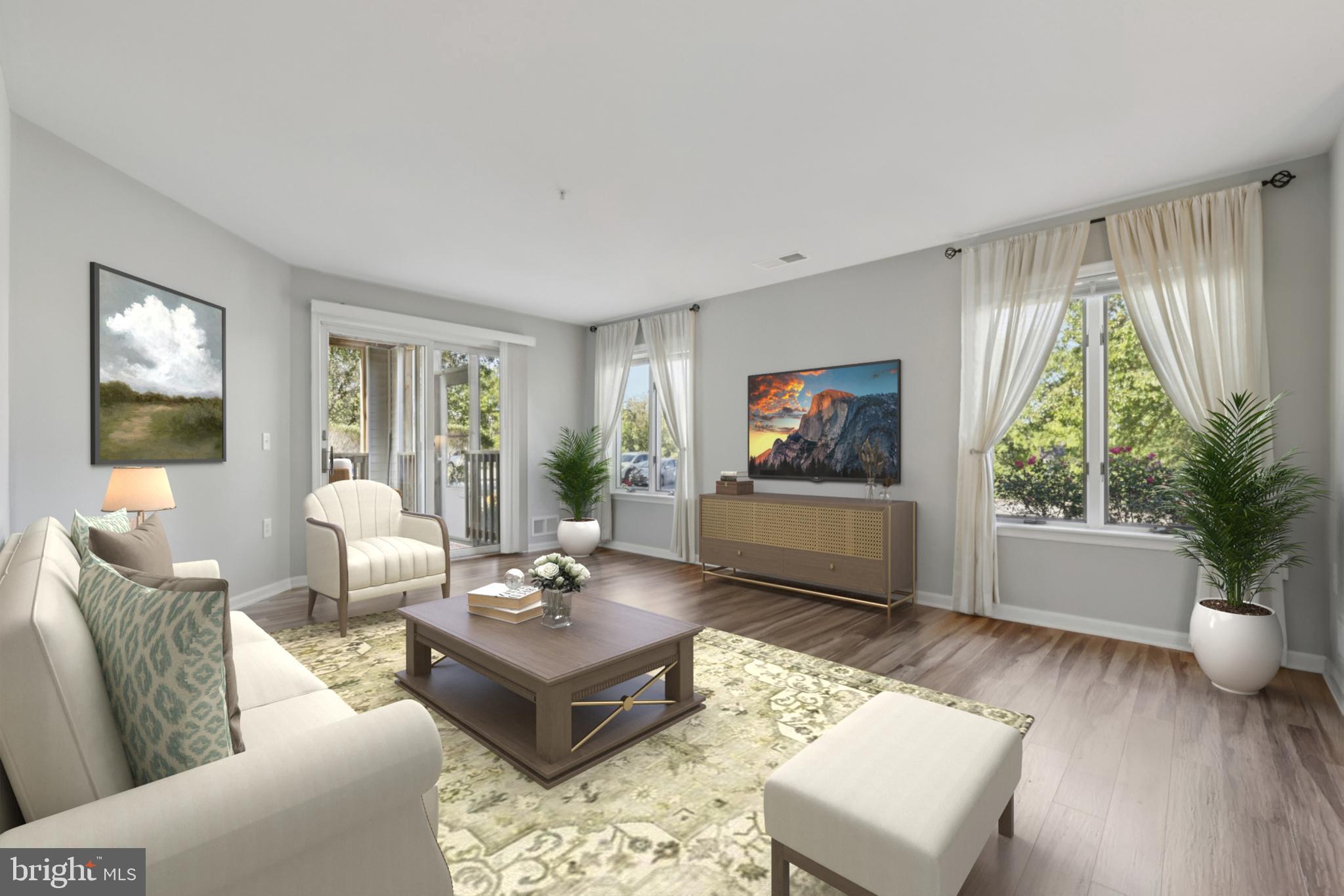 465 Pleasanton Road, Unit C14 Westminster, MD 21157 - Photo 14 of 39 a living room with furniture a flat screen tv and a large window