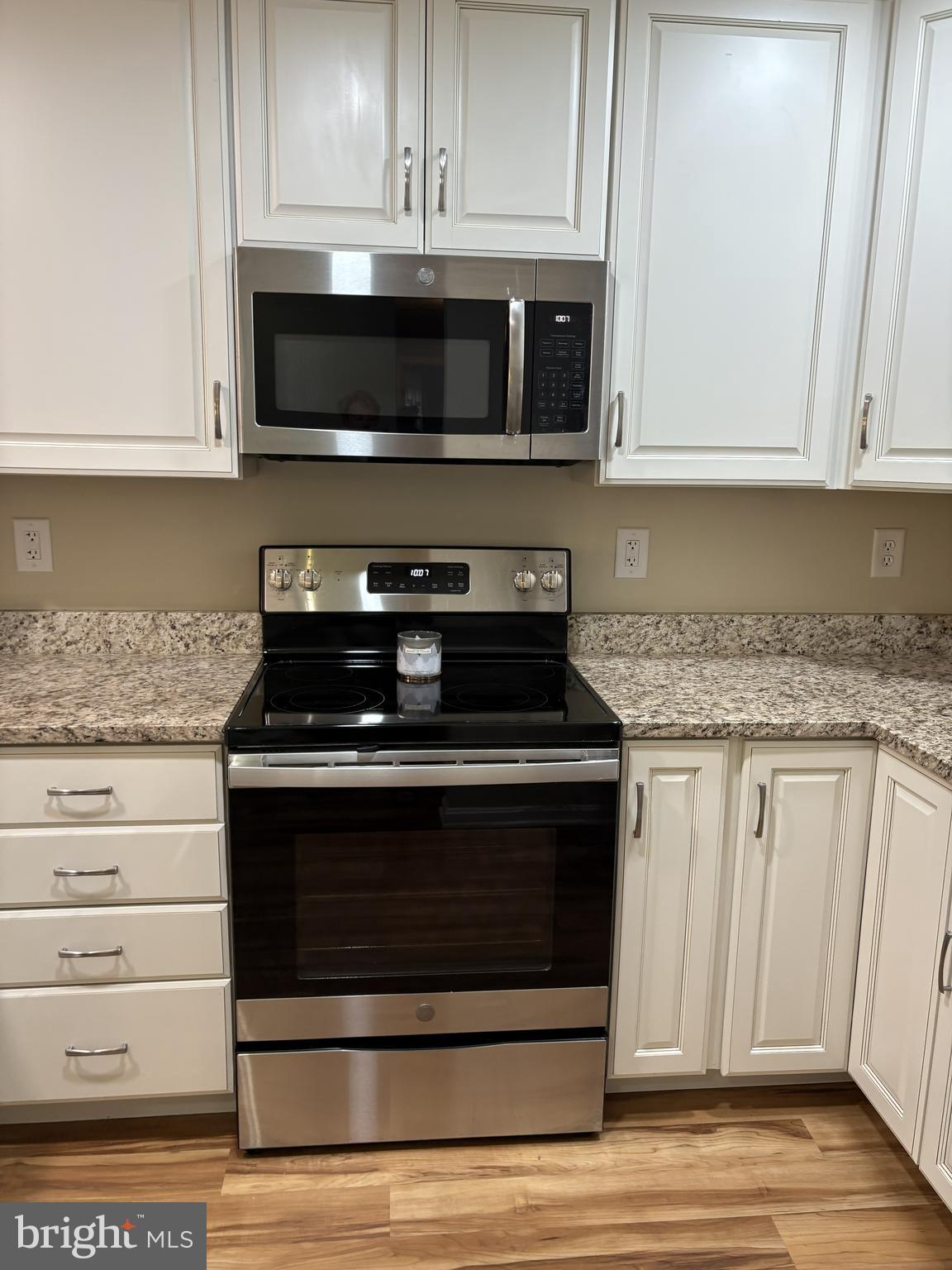 465 Pleasanton Road, Unit C14 Westminster, MD 21157 - Photo 17 of 39 a kitchen with stainless steel appliances granite countertop a stove microwave and cabinets