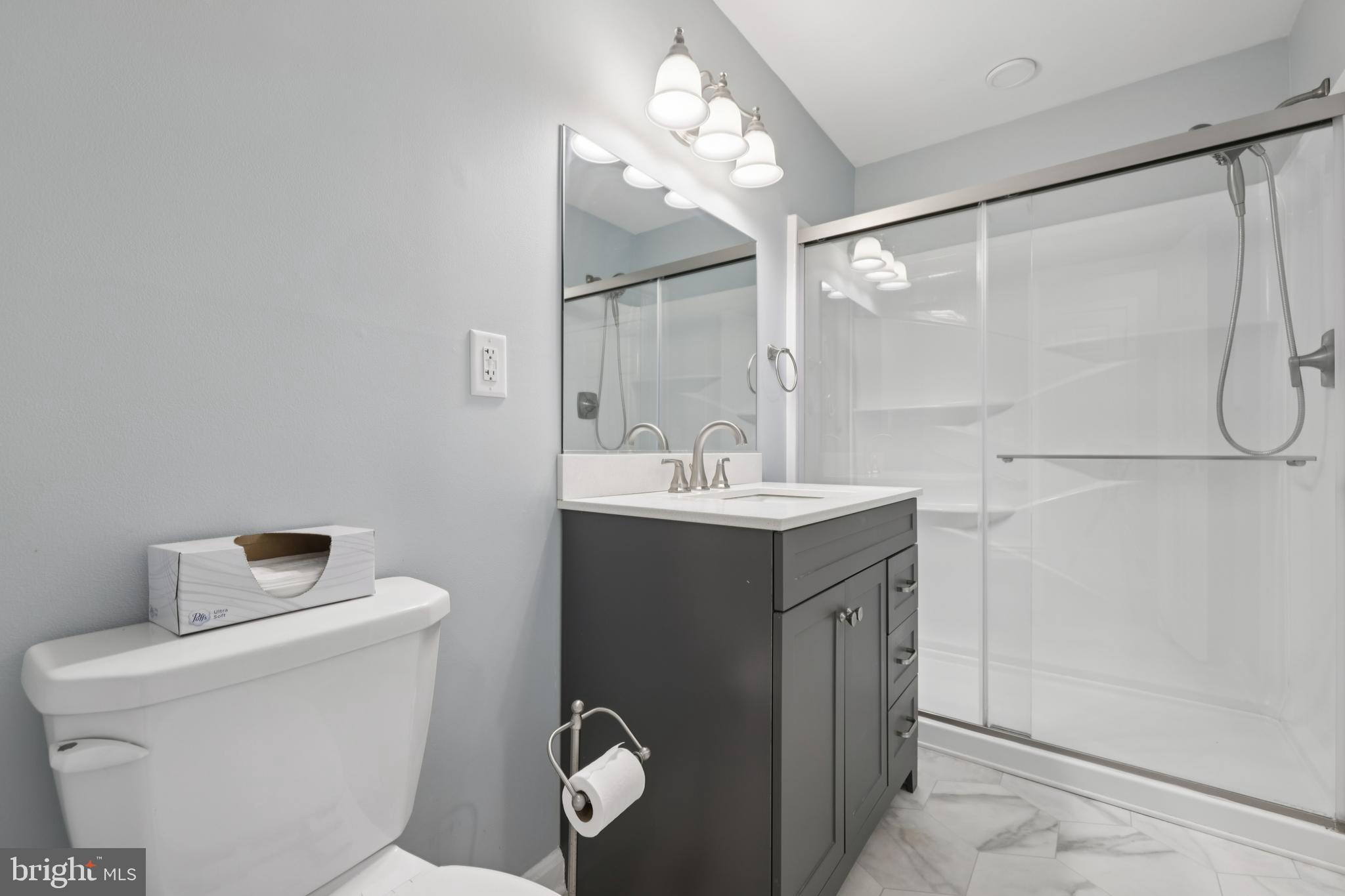 465 Pleasanton Road, Unit C14 Westminster, MD 21157 - Photo 19 of 39 a bathroom with a sink mirror vanity and toilet