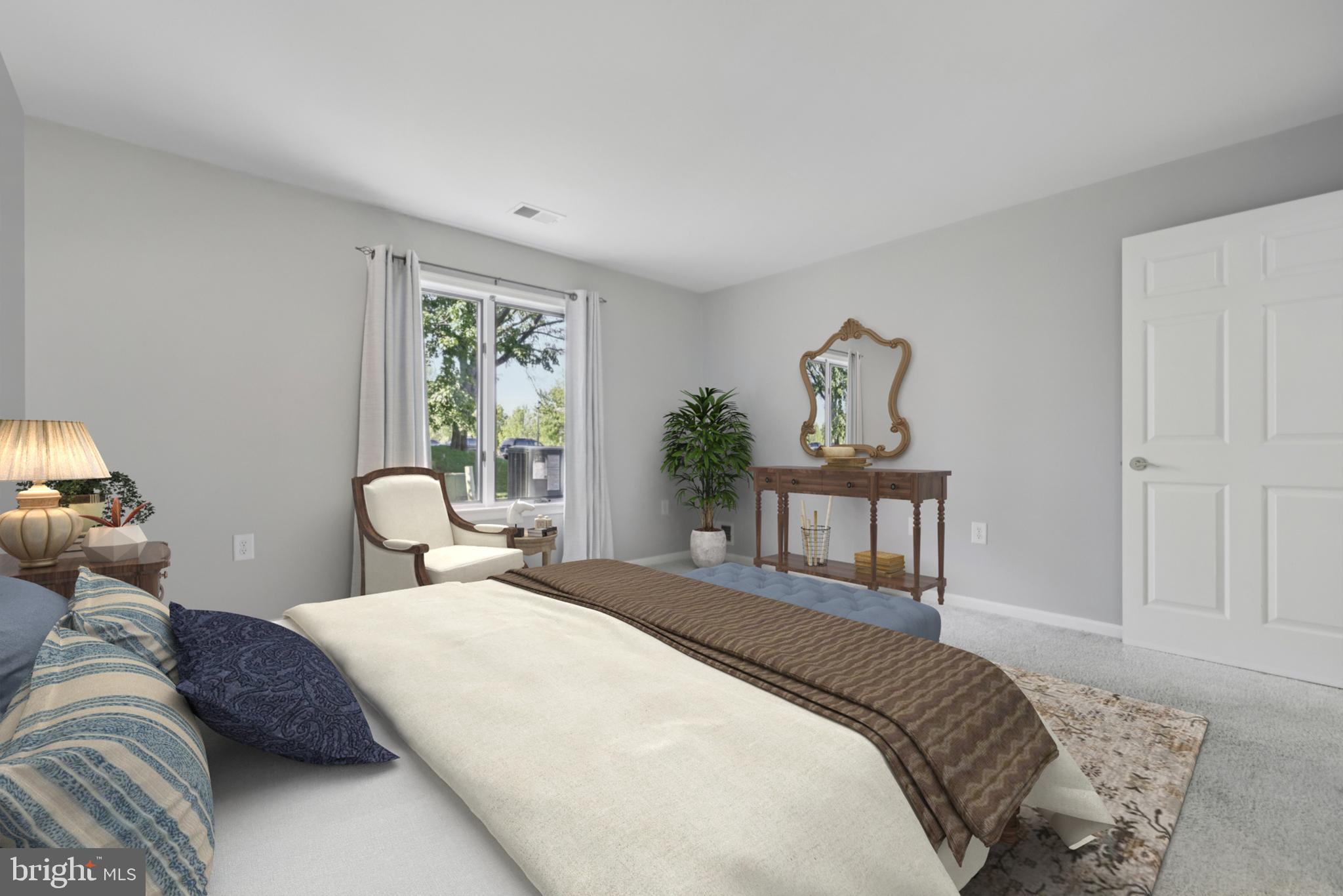 465 Pleasanton Road, Unit C14 Westminster, MD 21157 - Photo 24 of 39 a bedroom with a bed and wooden floor