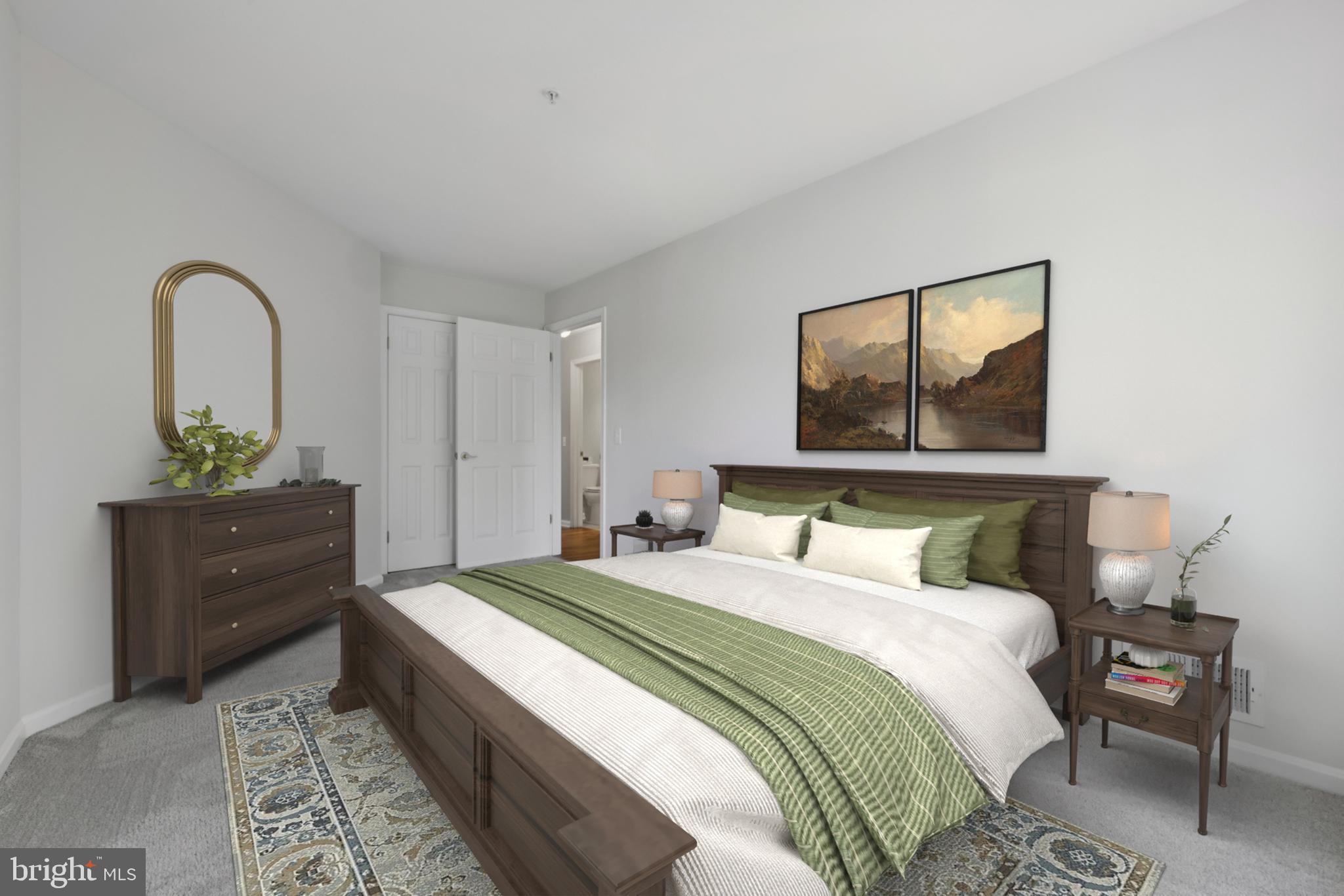 465 Pleasanton Road, Unit C14 Westminster, MD 21157 - Photo 30 of 39 a bedroom with a bed and a potted plant