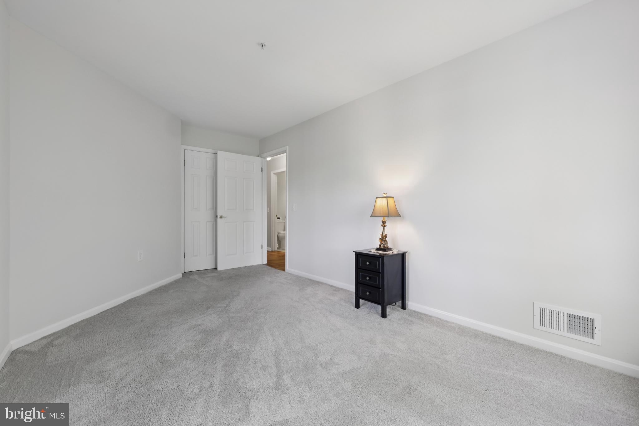 465 Pleasanton Road, Unit C14 Westminster, MD 21157 - Photo 31 of 39 a view of a room with cabinet and a lamp