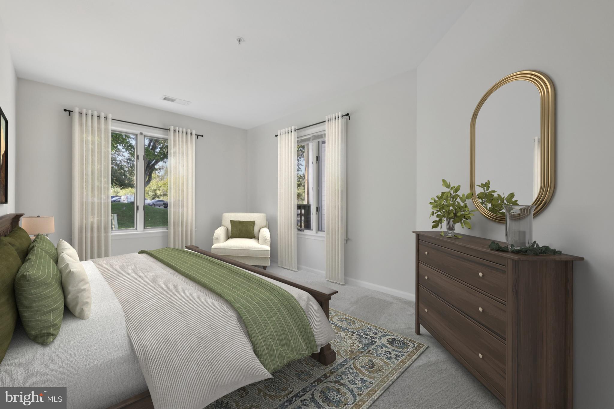 465 Pleasanton Road, Unit C14 Westminster, MD 21157 - Photo 32 of 39 a bedroom with a bed and a potted plant