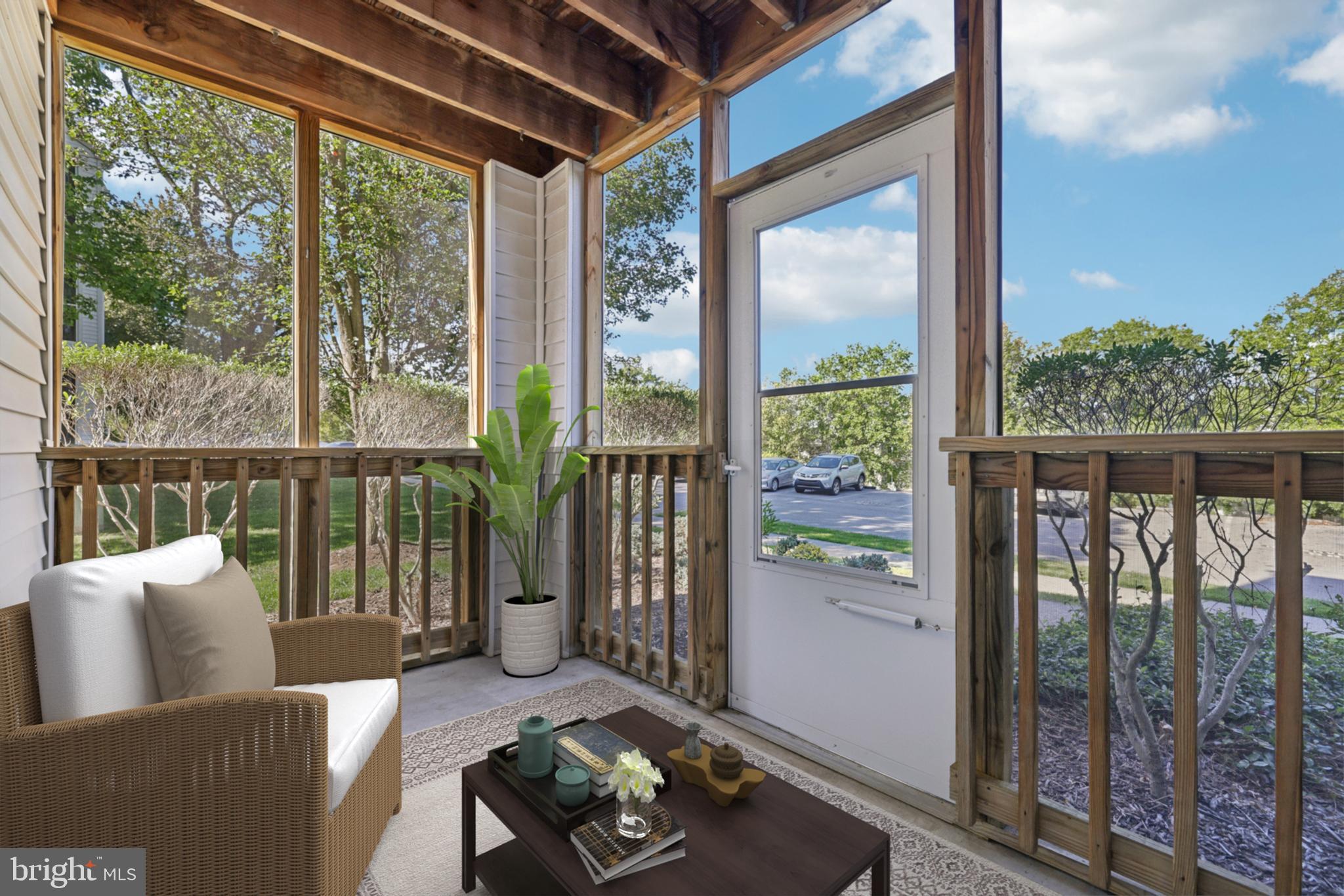465 Pleasanton Road, Unit C14 Westminster, MD 21157 - Photo 36 of 39 a living room with furniture and a floor to ceiling window