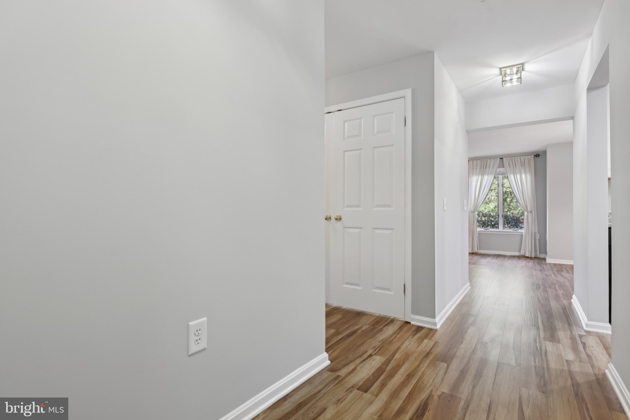 465 Pleasanton Road, Unit C14 Westminster, MD 21157 - Photo 7 of 39 a view of a hallway with wooden floor