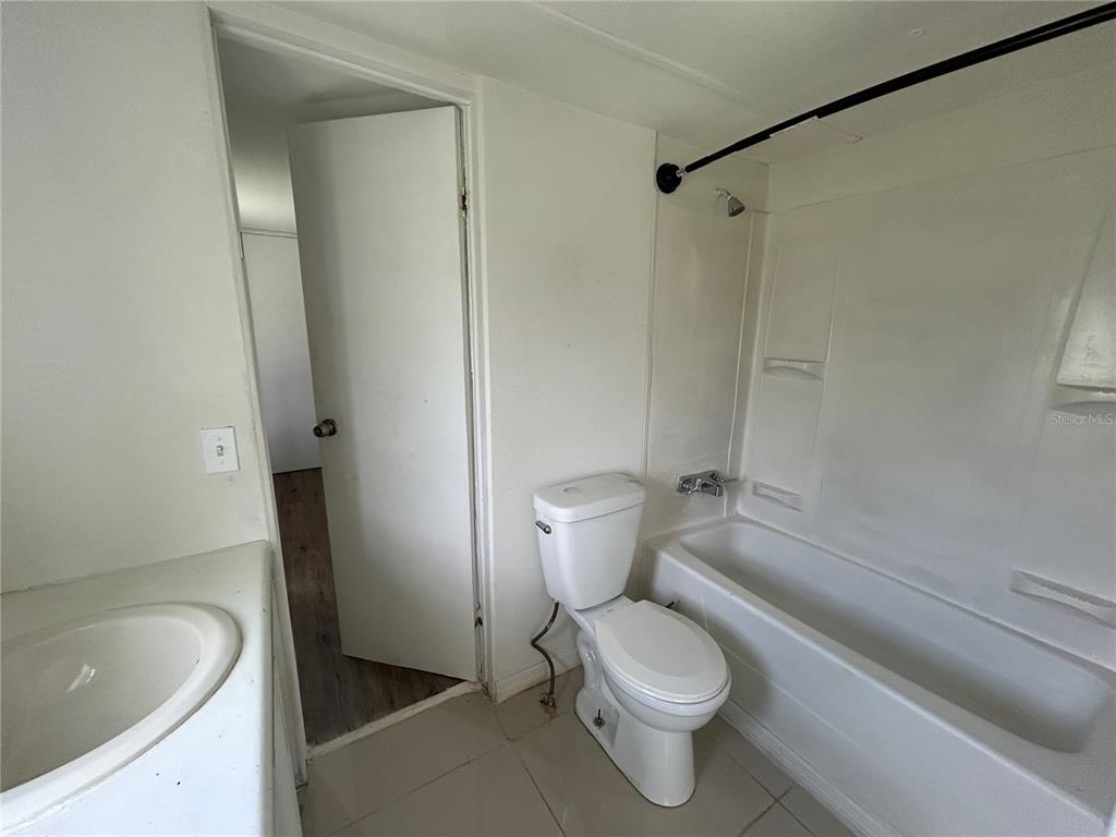 4265 North Beginning Path Crystal River, FL 34428 - Photo 12 of 18 a white toilet sitting next to a bath tub